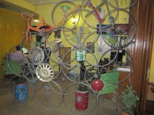 Room divider made of old bicycle wheels at Sweccha's Delhi office.